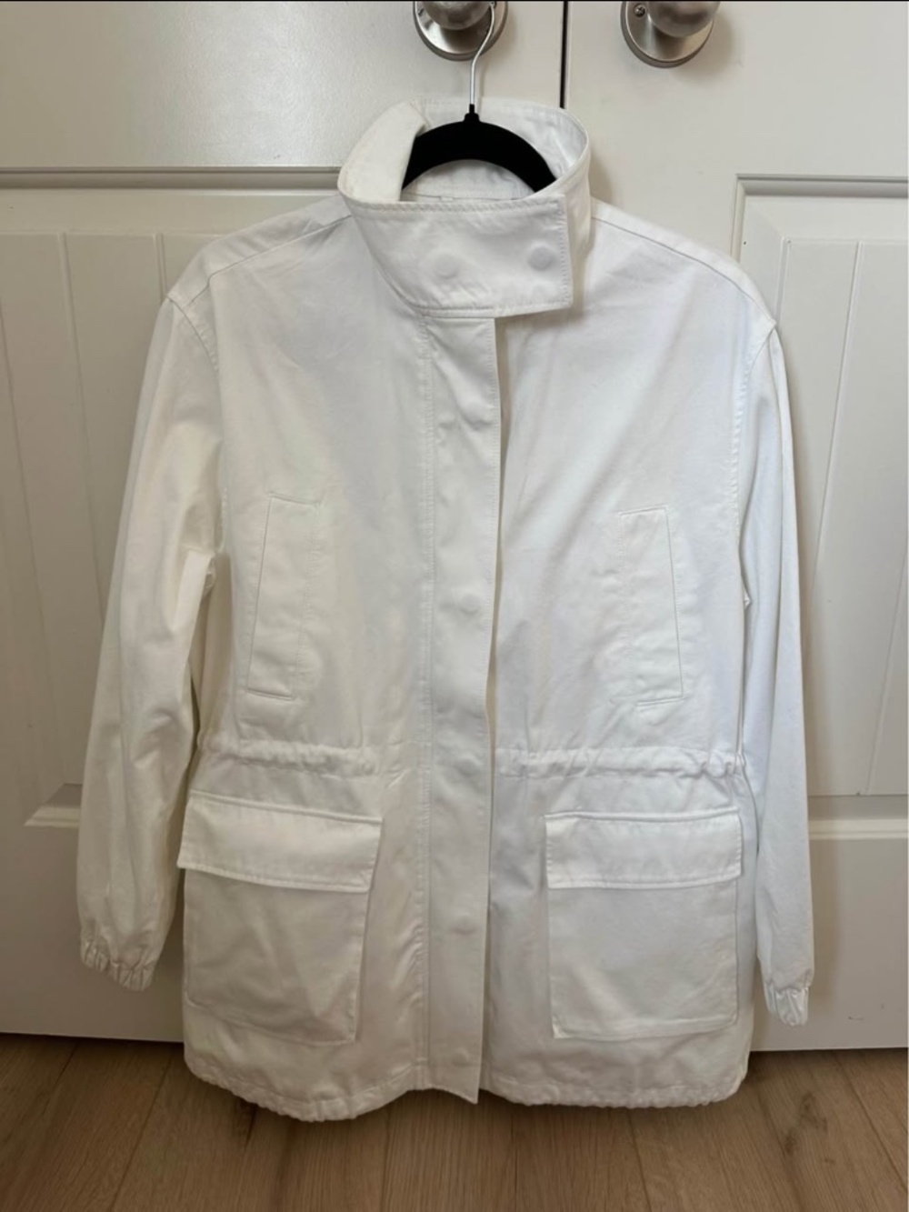 Aritzia Granados Jacket in white, featuring a high collar, utility p